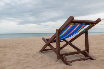 Beach chair on the sand with sea and sky