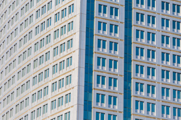 Fototapeta premium Modern office building with glass reflection