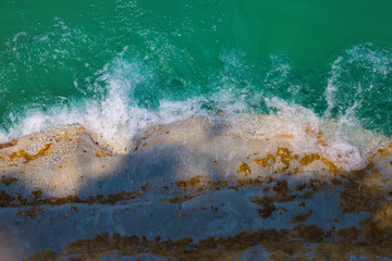 Wave crushing into a rock