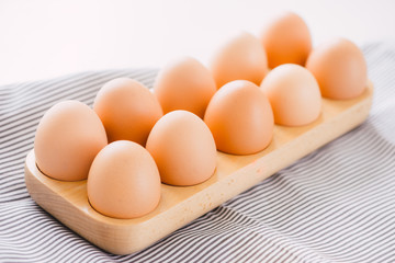 Farm raw fresh egg in pack on gray table ingredient for breakfast preparation scrambled eggs omelet fried egg