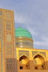 Close-up on Mir-i Arab Madrasa at sunset in Bukhara, Uzbekistan