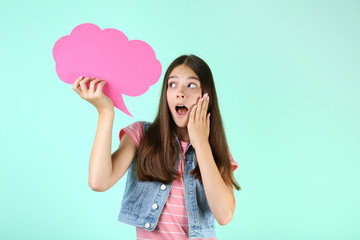 Young girl with speech bubble on mint background