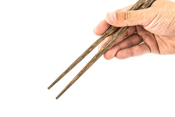 Wooden chopsticks in hand isolated on white