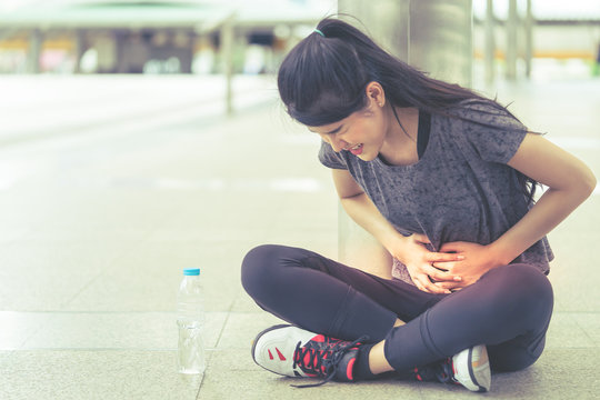 Sport woman is having an injury on her stomachache peroid