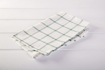 Green napkin on white table