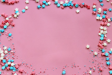 Sugar topping for cake, frame on a pink background, free space for text. The concept of the holiday, birthday.
