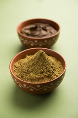 Henna / Mehandi powder and paste. Prepared for Hair colouring or for tattoo on hand in Indian weddings/festivals. selective focus