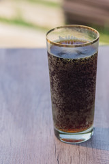 two jars of cold fresh russian kvass on wooden table outdoors