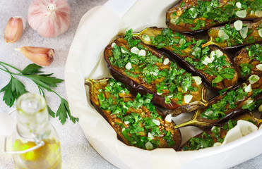 Eggplant baked with garlic, parsley and olive oil. Gourmet salad.  Traditional Sardinian (Sassari)...
