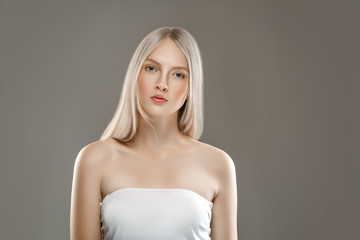 Beautiful Woman Face Portrait Beauty Skin Care Concept with long blonde hair 