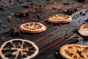 Dried fruits with spices on wooden background