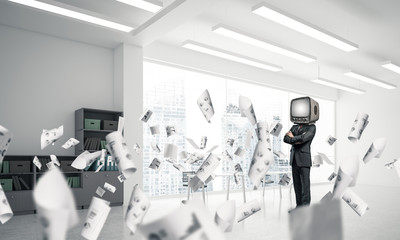 Businessman with an old TV instead of head.