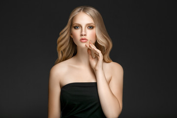 Naklejka premium Beautiful Woman Face Portrait Beauty Skin Care Concept with long blonde hair 