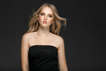 Naklejka premium Beautiful Woman Face Portrait Beauty Skin Care Concept with long blonde hair 