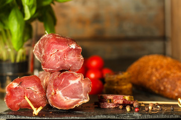 salami, salted meat jerky - sliced ​​with slices (venison) . food background.  Top view with copy space