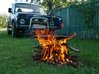 Polonne / Ukraine - 13 August 2018: Barbecue close up. Cooking outdoors from the grill on background car