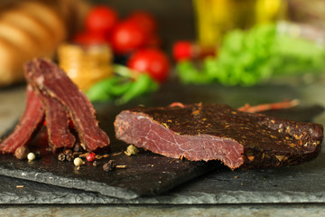 salami, salted meat jerky - sliced ​​with slices (venison) . food background.  Top view with copy space