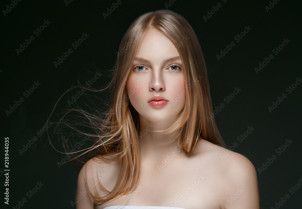 Wall mural Beautiful Blonde Woman Beauty Model Girl with perfect makeup over black background.