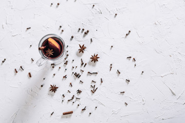 Mulled wine with spices and empty space for text on white background