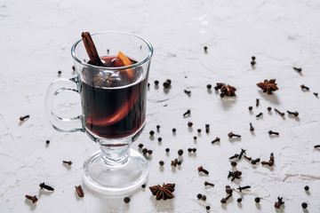Mulled wine with spices and empty space for text on white background
