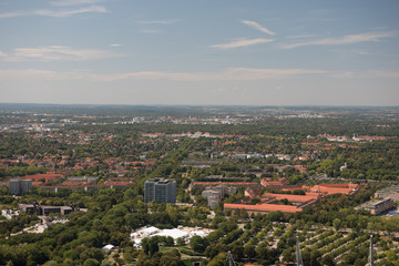 Fototapeta na wymiar View from Olympic tower in Munich with palace in distance. Landscape view on the city Munich with blue sky.