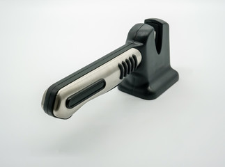 Black and silver knife sharpener isolated on white