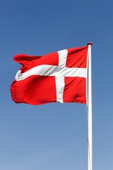 Flag of Denmark waving in the sky