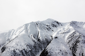 Mountain landscape, frozen hill, snow and glacier, winter landscape in Gudauri, Georgia.