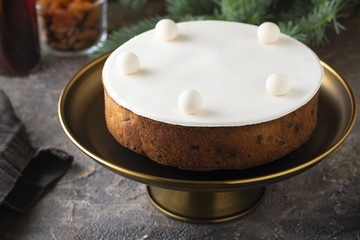 Christmas fruit cake, pudding on white plate. Copy space.