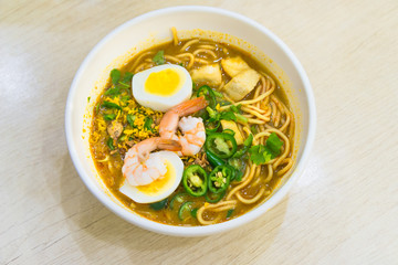 Laksa noodles is a spicy soup popular in Singapore local delicious food