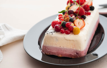 Vanilla and berries ice cream loaf cake, selective focus. Semifredo.