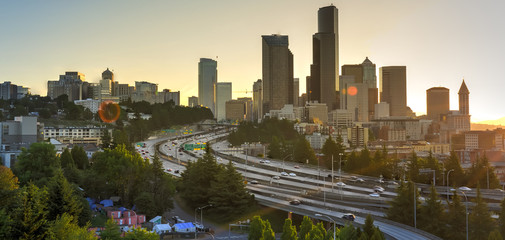 Panoramic view Seattle skylines and rush hour traffic on highway I-90 and I-5 interchange. Nearby...