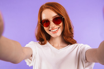 Portrait of a pretty young girl in sunglasses