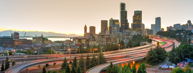 Panoramic view Seattle skylines and rush hour traffic on highway I-90 and I-5 interchange. Nearby...