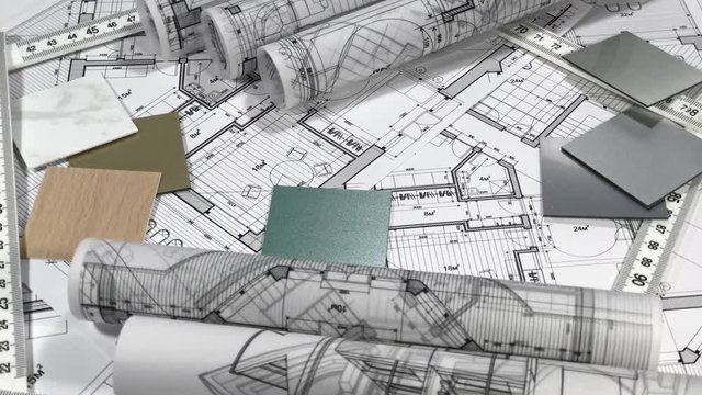 Blueprints: architectural drawings, yardstick - folding ruler & samples of modern interior decoration materials - decorative plastics smoothly rotate on the surface of the architectural plan