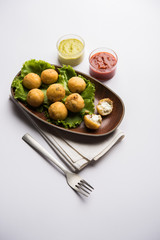 Dahi Ke Angare also known as Kabab or kebab is a popular snack item from India / Pakistan. served with green and red sauce. Selective focus