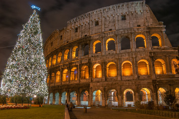 Fototapeta na wymiar Night in Rome, Christmas tree near Colosseum 