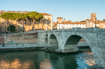 Old bridge in Rome, sunlight, Italy