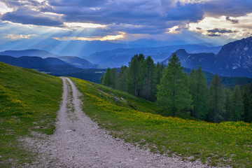 Naklejka na ściany i meble Italy Dolomites mountains sunset clouds meadow