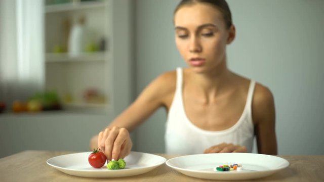 Girl chooses vegetables instead of weight loss drugs, healthy diet, organic food