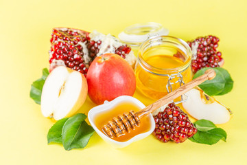 Rosh hashana jewish holiday concept - apples, honey, pomegranate