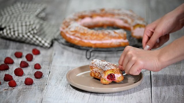 Homemade choux pastry cake Paris Brest with raspberries. French dessert.