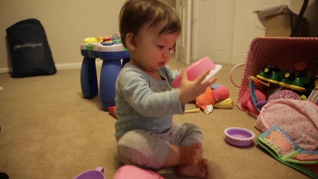 Happy Baby Banging on Toys