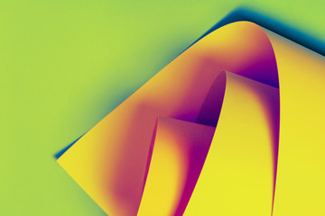 Neon yellow pink paper background. colorful paper origami texture