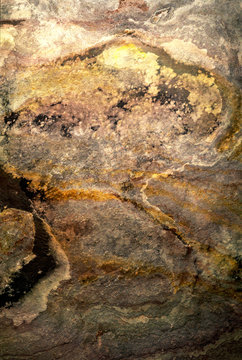 Stone texture background with warm metallic tones