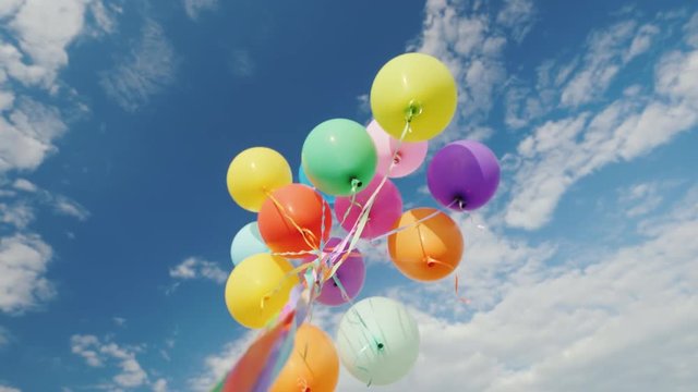 Many multi-colored balloons aspire to the sky