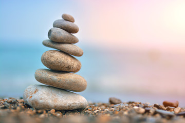 Fototapeta premium Relaxing on the beach, stack of stones.