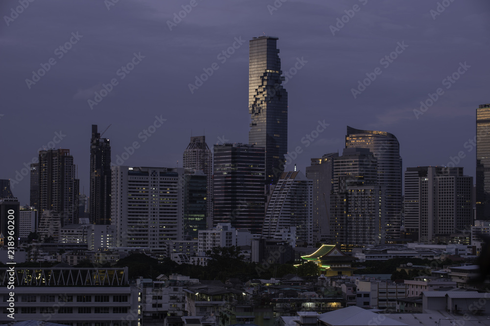 Wall mural city scape of bangkok business building and hotel in the sunset time.