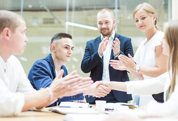 Group of business meeting at the table in the modern office ,Team work and diverse hands together joining business relationships with greetings and joint business partnership.