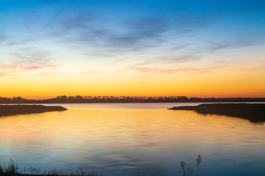 Pre Dawn Sky Over Lake In Florida